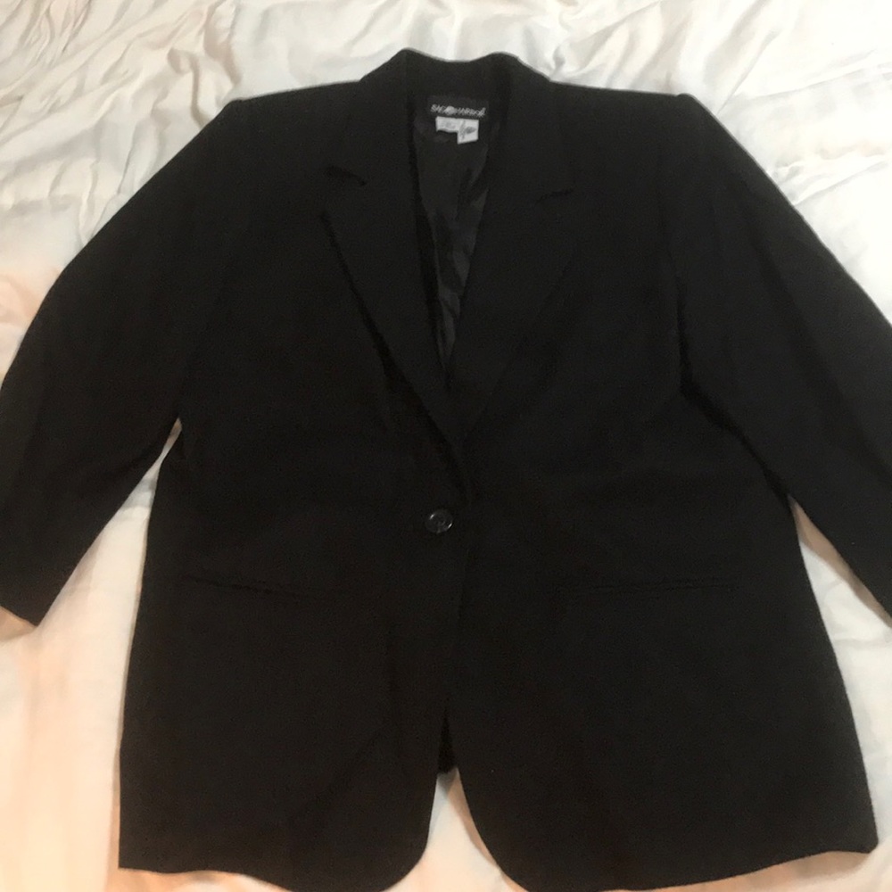 Woman’s black blazer coat